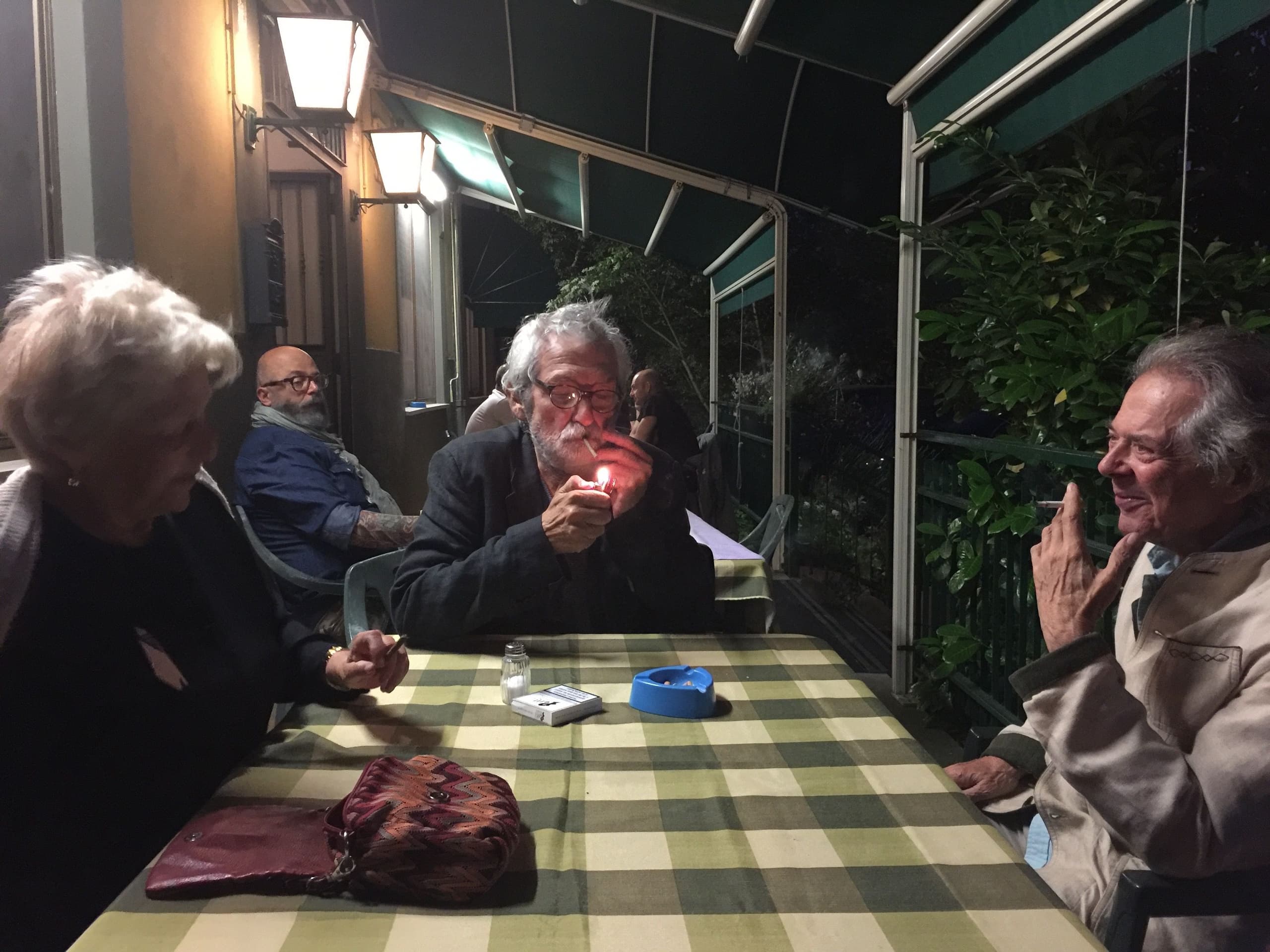 Beatriz, Oscar and Franco, smoking and talking after dinner
